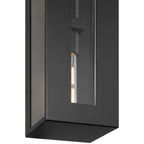 Close-up of the Access Lighting Chatham 2 Light Outdoor Wall Mount, a modern black rectangular outdoor wall fixture with visible bulbs inside, viewed from a downward angle.