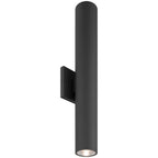 Access Lighting’s Sunset Bi-Directional Outdoor LED Wall Washer (19977LEDMG) features a matte black cylindrical design with illumination directed from the bottom, mounted on a rectangular wall plate.