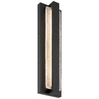 The Riviera LED Outdoor Wall Mount by Access Lighting features a vertical design with a black rectangular frame and a central illuminated textured glass panel, using 24W LED lighting.
