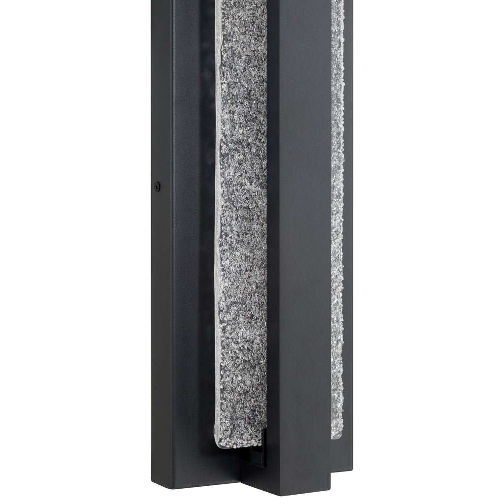 Close-up of the Access Lighting Riviera LED Outdoor Wall Mount, 24W—a modern rectangular black metal fixture featuring a vertically running, textured granite-like accent.