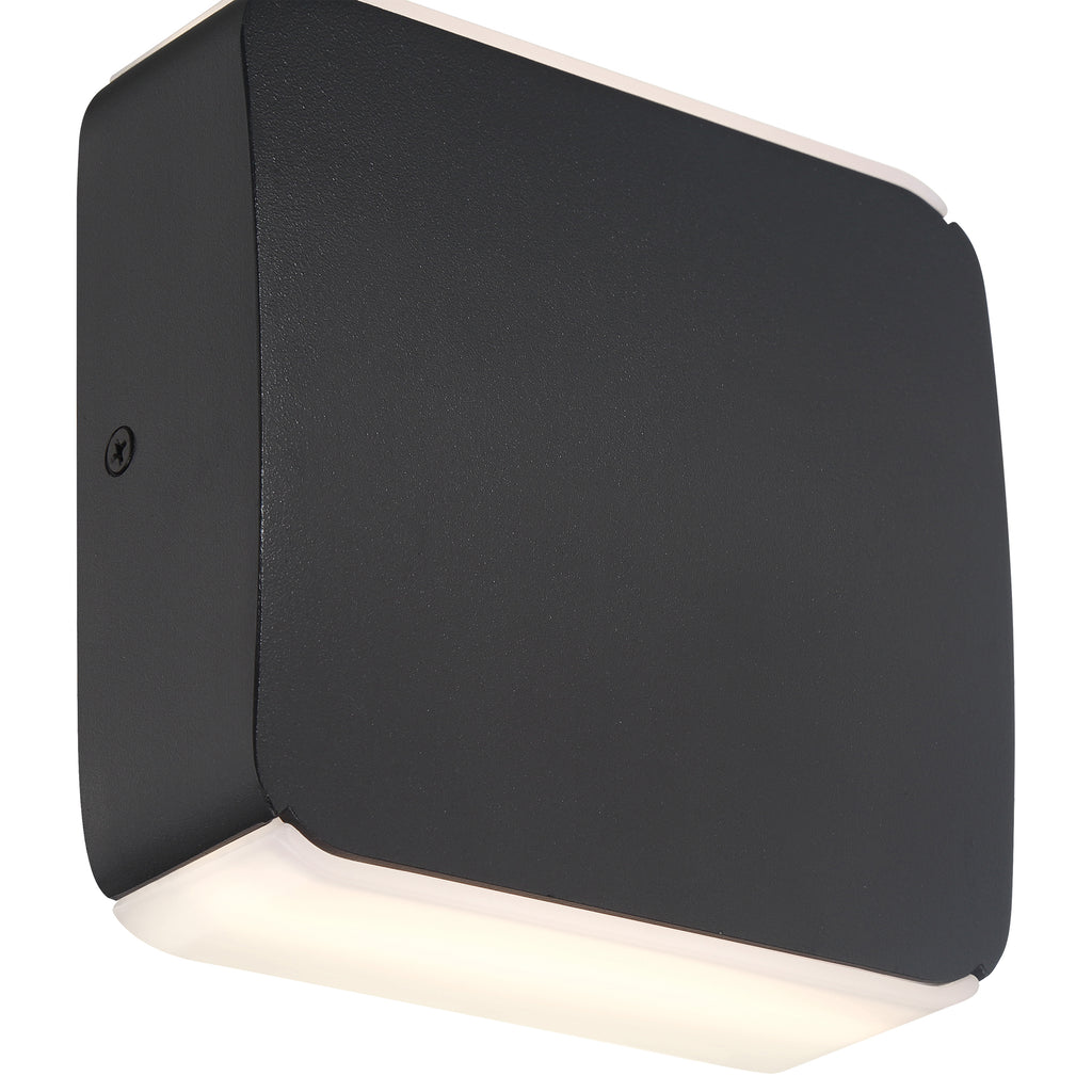 The Newport Bi-Directional Outdoor LED Wall Mount by Access Lighting is a rectangular, black wall-mounted fixture featuring softly rounded edges and frosted lenses on both the top and bottom for diffused illumination.