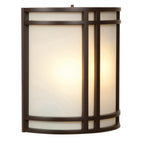 The Artemis 2 Light Outdoor LED Wall Mount by Access Lighting features a frosted glass shade encased in a dark bronze geometric frame, beautifully illuminated from within.