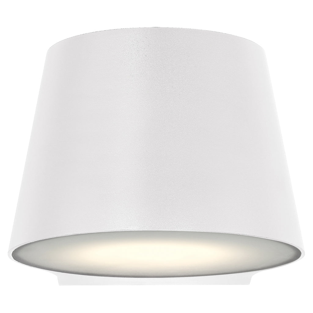 The Ry Bi-Directional Outdoor LED Wall Mount by Access Lighting features a white, cone-shaped design with a smooth finish and emits a soft glow from its downward-facing opening.