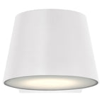 The Ry Bi-Directional Outdoor LED Wall Mount by Access Lighting features a white, cone-shaped design with a smooth finish and emits a soft glow from its downward-facing opening.