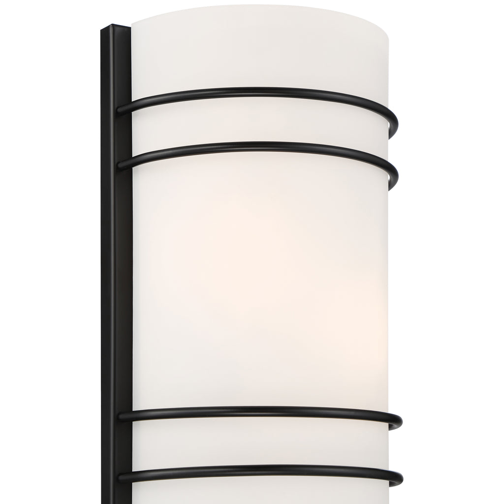 The Cassi 2 Light Wall Sconce by Access Lighting features a frosted white cylindrical shade accented with three horizontal matte black metal bands.