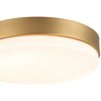Close-up of the Access Lighting Roma Minimus LED Flush Mount in Antique Brushed Brass, featuring a frosted white diffuser.