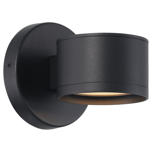 The Ari Bare Outdoor LED Wall Mount by Access Lighting is a black, cylindrical wall sconce with a round base that mounts on the wall and emits light downward from the bottom of the fixture.