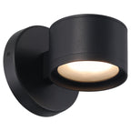 Ari Bare Outdoor LED Wall Mount by Access Lighting in a modern black cylindrical design with a round base, casts a bright, downward-facing glow against a plain white background.