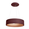 The Radiant Dual Voltage LED Pendant by Access Lighting features a modern, circular design with a brick-colored shade, suspended from the ceiling by three thin wires.