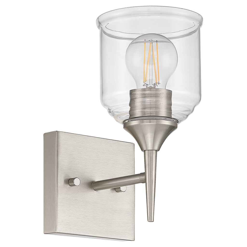 The Beacon 1 Light Wall Sconce by Access Lighting features a brushed steel base, a straight arm, and a transparent glass shade that reveals the light bulb.