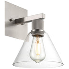 The Port Nine Martini LED Wall Sconce by Access Lighting features a brushed steel base and a clear glass cone-shaped shade, complete with an energy-efficient 7W LED bulb.