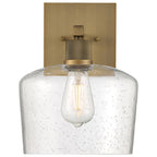Port Nine Chardonnay LED Wall Sconce by Access Lighting features an antique brushed brass backplate, a clear seeded glass shade, and a 7W LED that evokes the look of a vintage-style filament bulb.