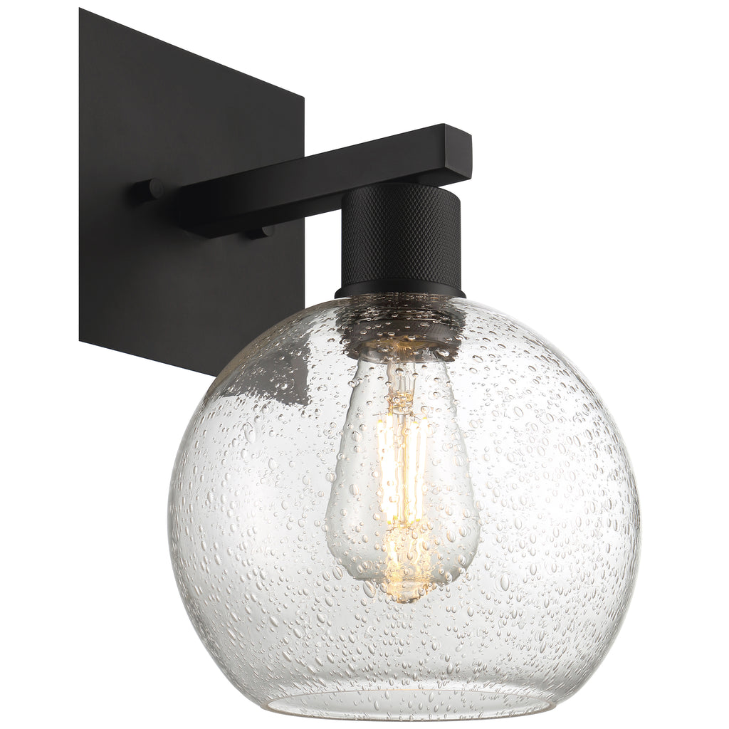 The Port Nine Burgundy LED Wall Sconce by Access Lighting features a matte black metal base and arm, paired with a round clear seeded glass shade that encloses an exposed-style LED bulb (7W).