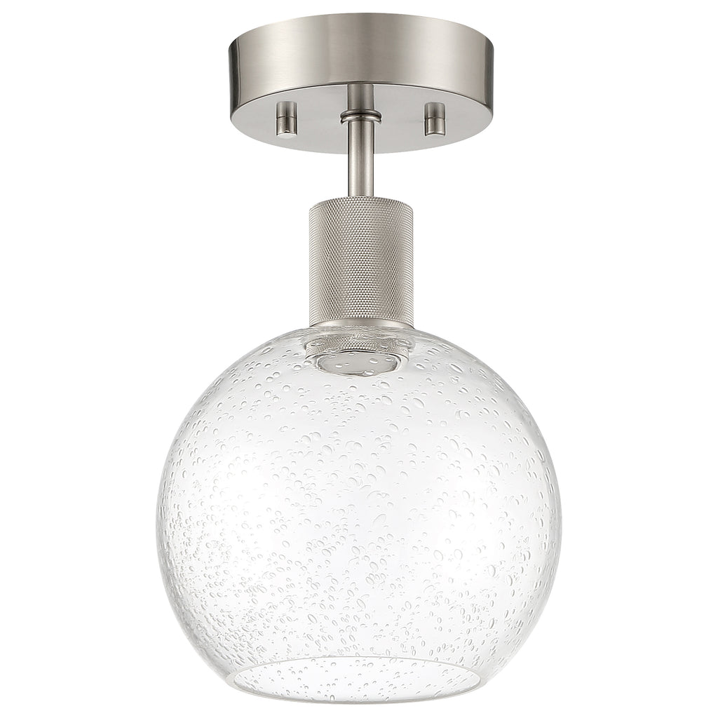 The Port Nine Burgundy LED Semi-Flush by Access Lighting is a modern ceiling light fixture featuring a brushed steel base and a seeded glass globe shade with bubble-like texture.
