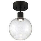 The Port Nine Burgundy LED Semi-Flush by Access Lighting features a matte black finish and a clear, seeded glass shade with a single visible 9W bulb inside.