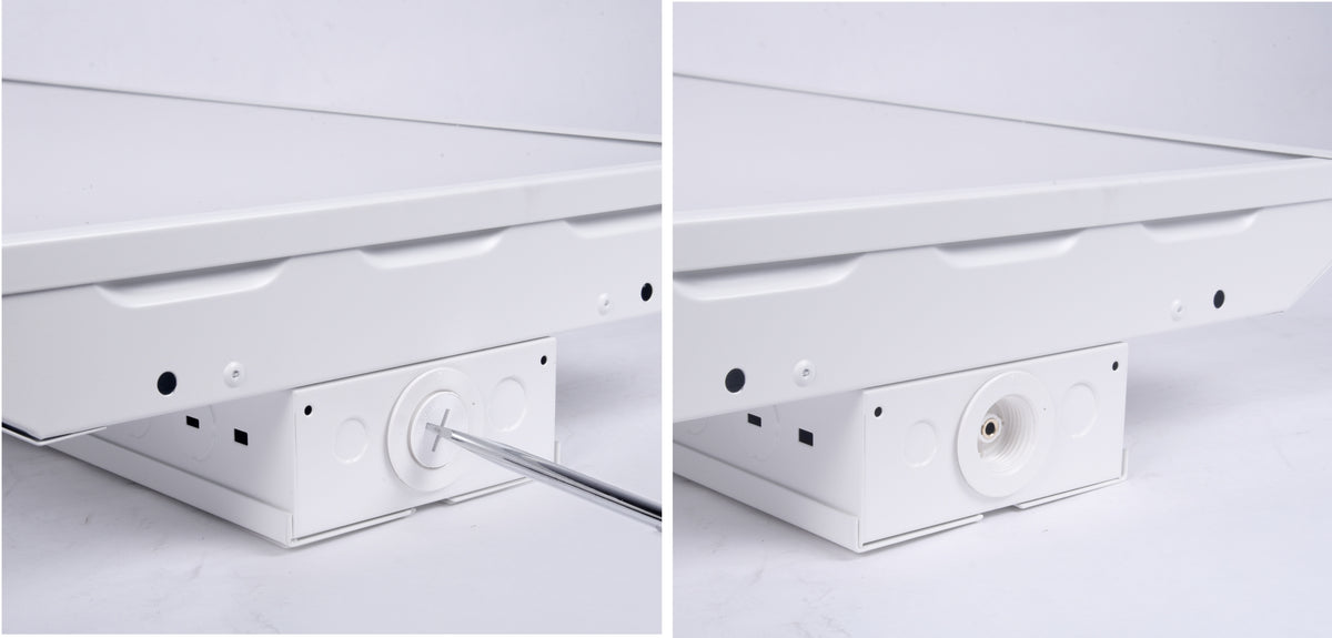Close-up of a GradeONE 150W Selectable LED Linear High Bay — Narrow, with a screwdriver being used to remove a circular cover on the white metal panel, revealing a socket beneath on the right side.