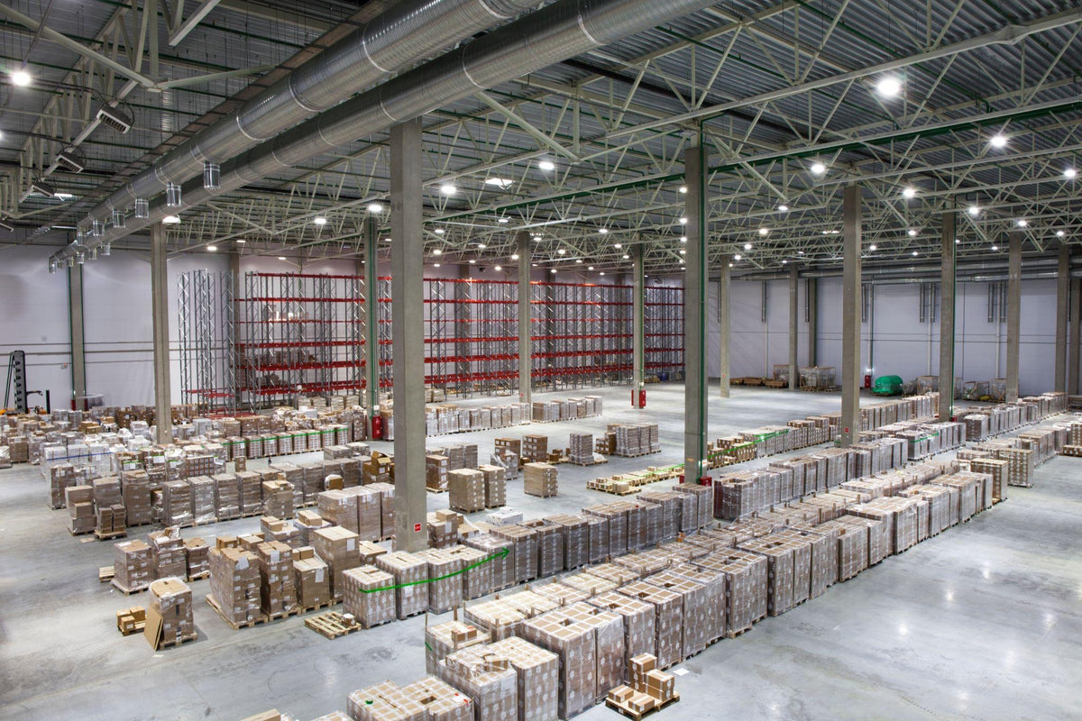 Bright warehouse lit by LED high bays