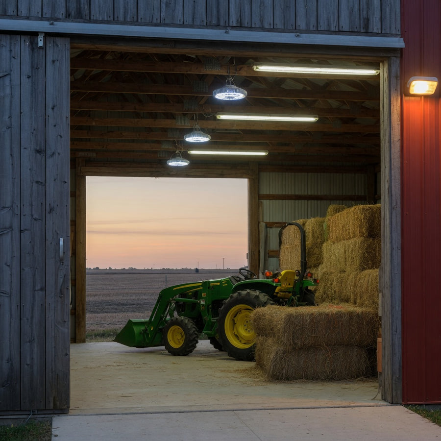 Pole barn interior lit by LED high bays, with a dusk-to-dawn light outside